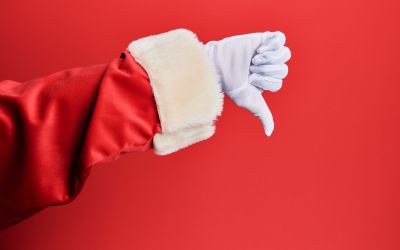 Photo of a red sleeve and white gloved hand giving a thumbs down to illustrate the article 